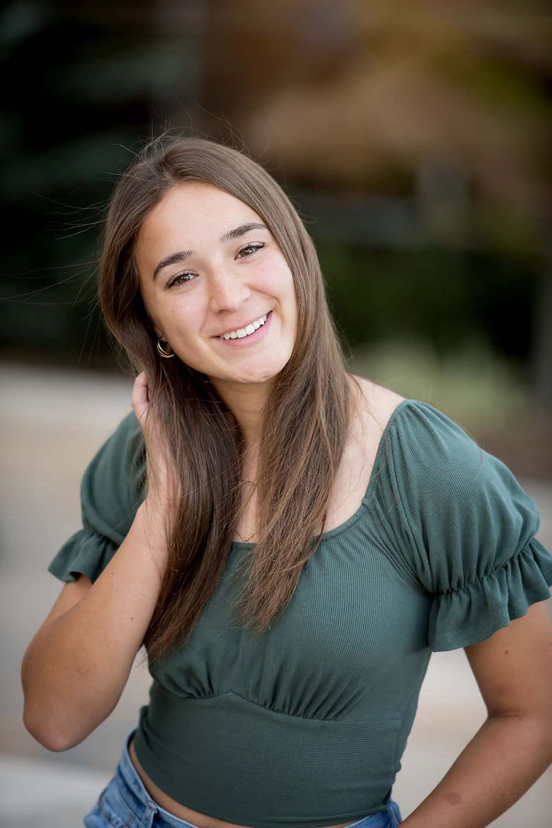 Woman with brown hair smiling