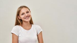 Girl smiling with Braces - Patient Forms